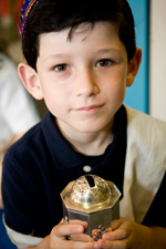 Boy with tzedakah box